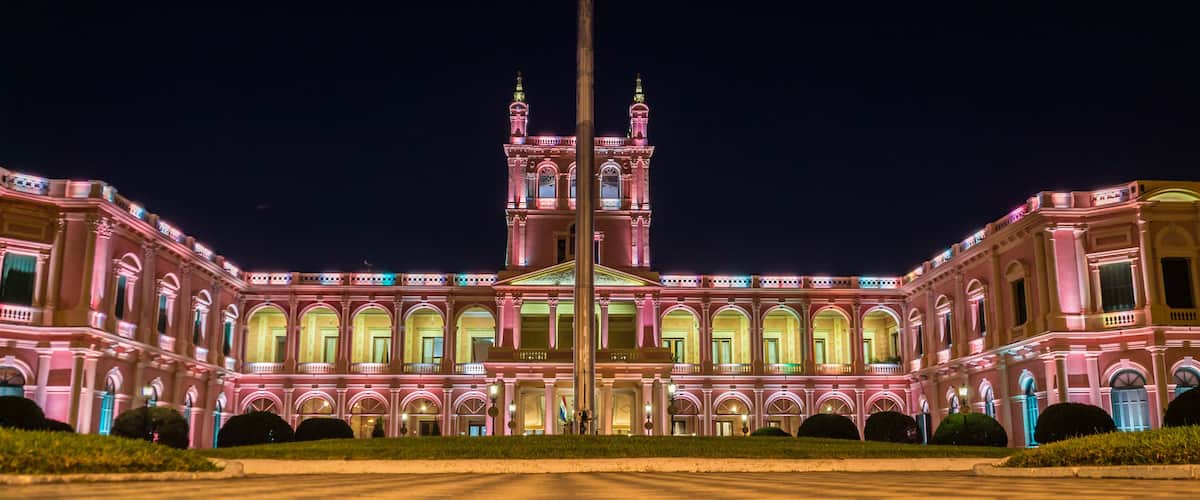 View on illuminated pink presidential palace in Asuncion, Paraguay at night