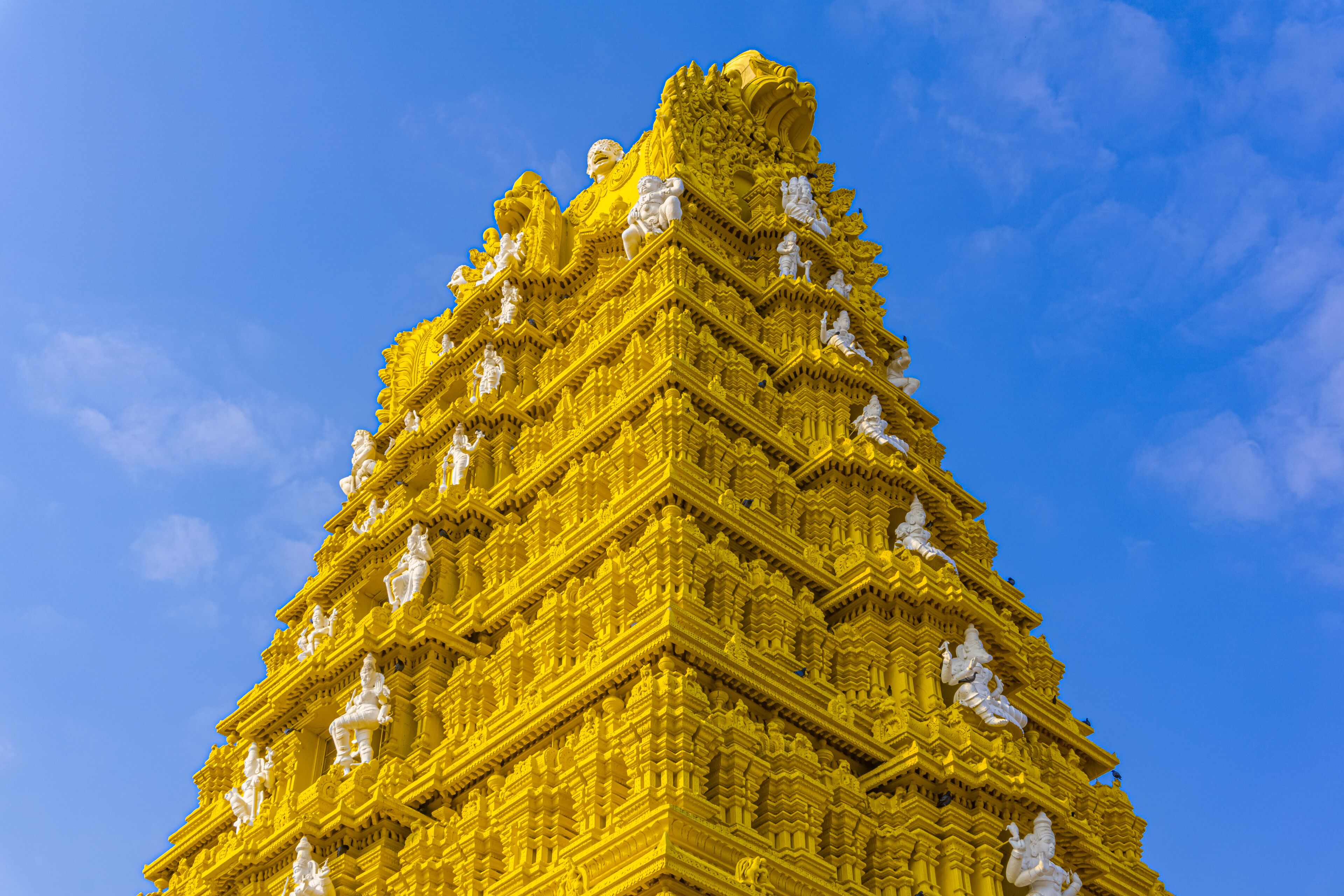 Chamundeshwari Temple is a Hindu temple located on the top of Chamundi Hills about 13 km from the palace city of Mysuru in the state of Karnataka in India. The temple was named after Chamundeshwari.