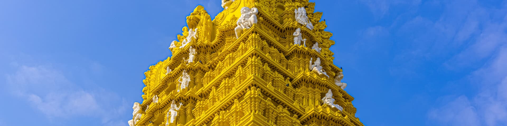 Chamundeshwari Temple is a Hindu temple located on the top of Chamundi Hills about 13 km from the palace city of Mysuru in the state of Karnataka in India. The temple was named after Chamundeshwari.