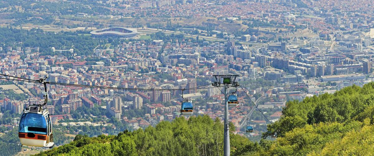 Panoramic view of Skopje and gondola cabin lift from Vodno mountain