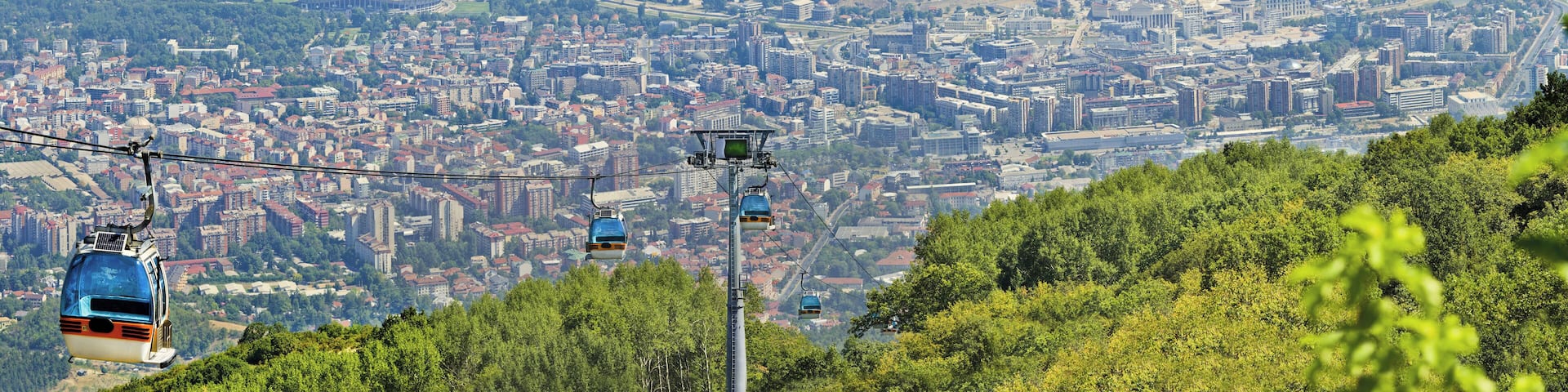 Panoramic view of Skopje and gondola cabin lift from Vodno mountain
