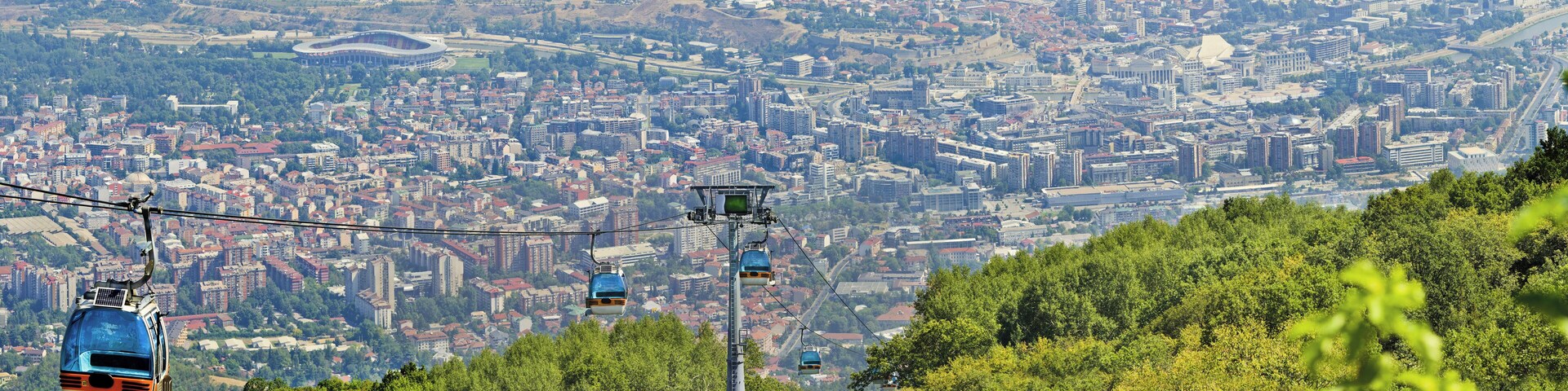 Panoramic view of Skopje and gondola cabin lift from Vodno mountain