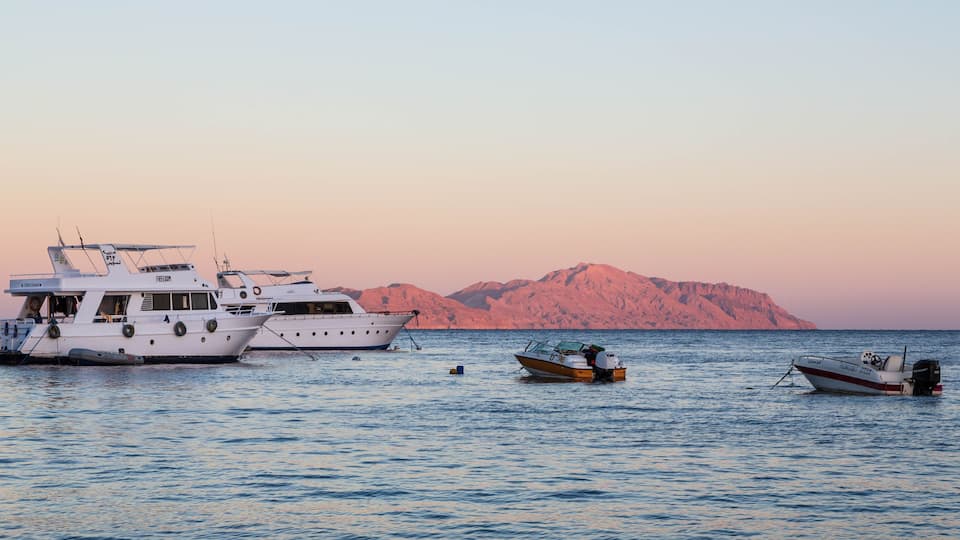 Sunset at Sharks Bay, Red Sea and motor yachts, Sharm el Sheikh, Egypt