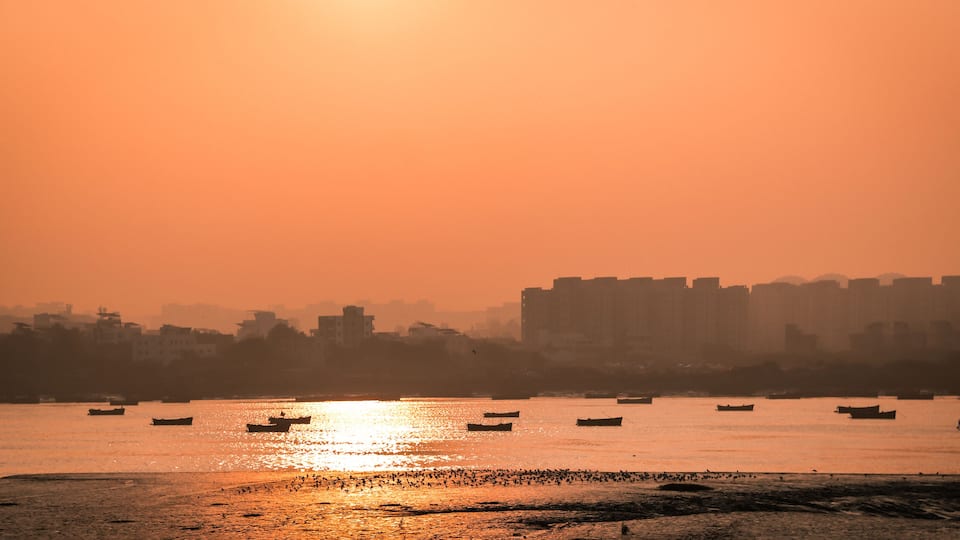 Panoramic silhouette of surat city while sun rising near ONGC bridge