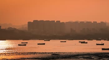 Panoramic silhouette of surat city while sun rising near ONGC bridge