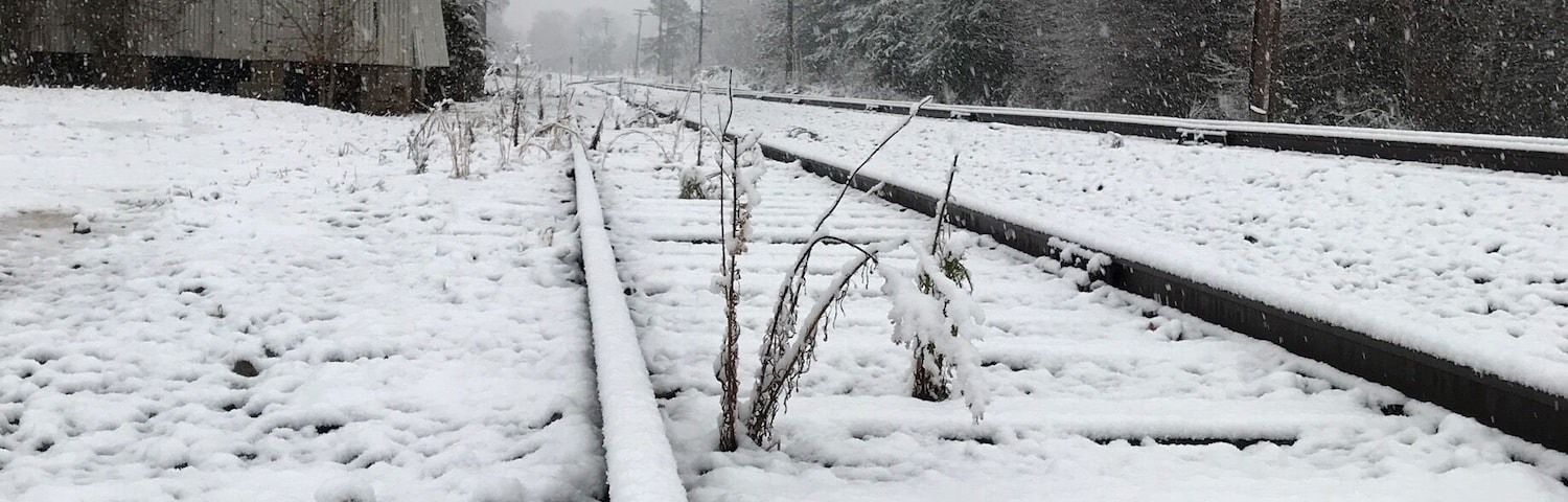 Peaceful afternoon, as a dusting of snow fell upon the tracks. Old Clemmons Station in the background.