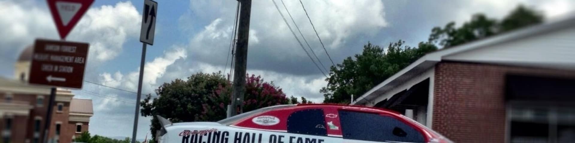The car that doubles as a sign pointing you towards the Georgia Racing Hall of Fame it is very unique because you do not expect something as unique as a racing hall of fame in a small town.