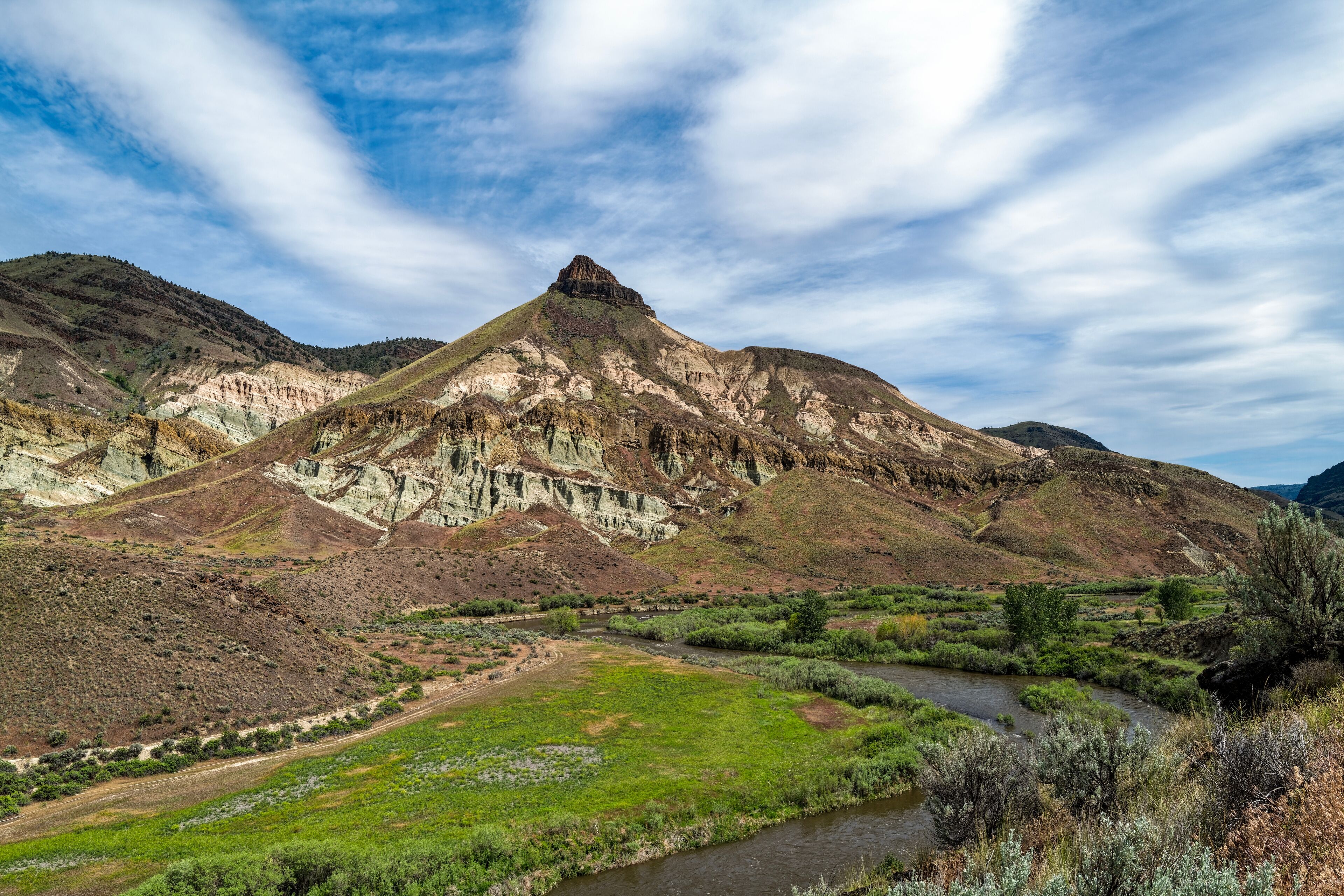 Historic Sheep Rock towers over the John Day River at the John Day Fossil Beds National Monument, Oregon, USA