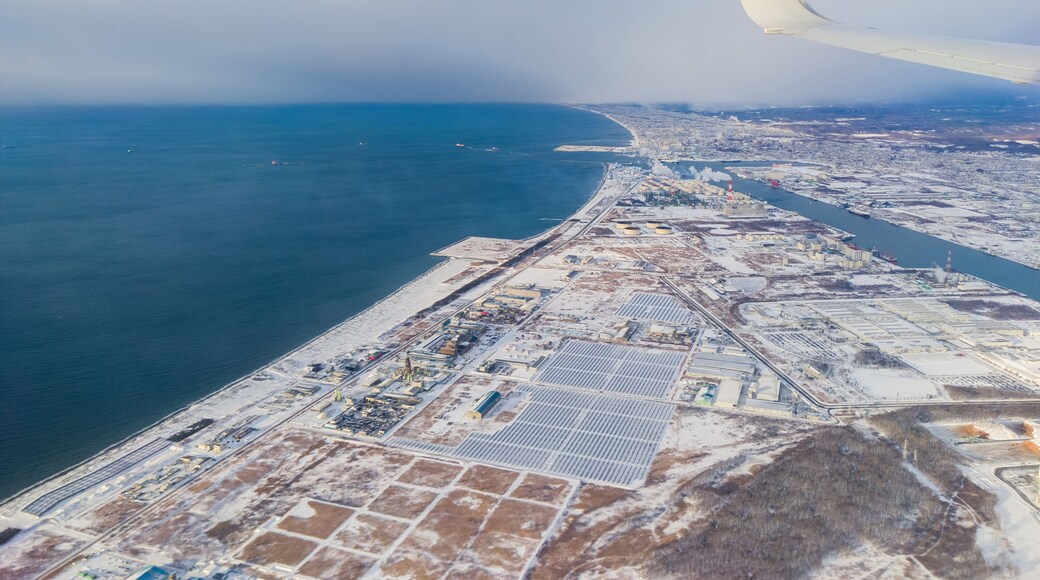 Snow-covered port town seen from the sky (Tomakomai, Hokkaido, Japan)