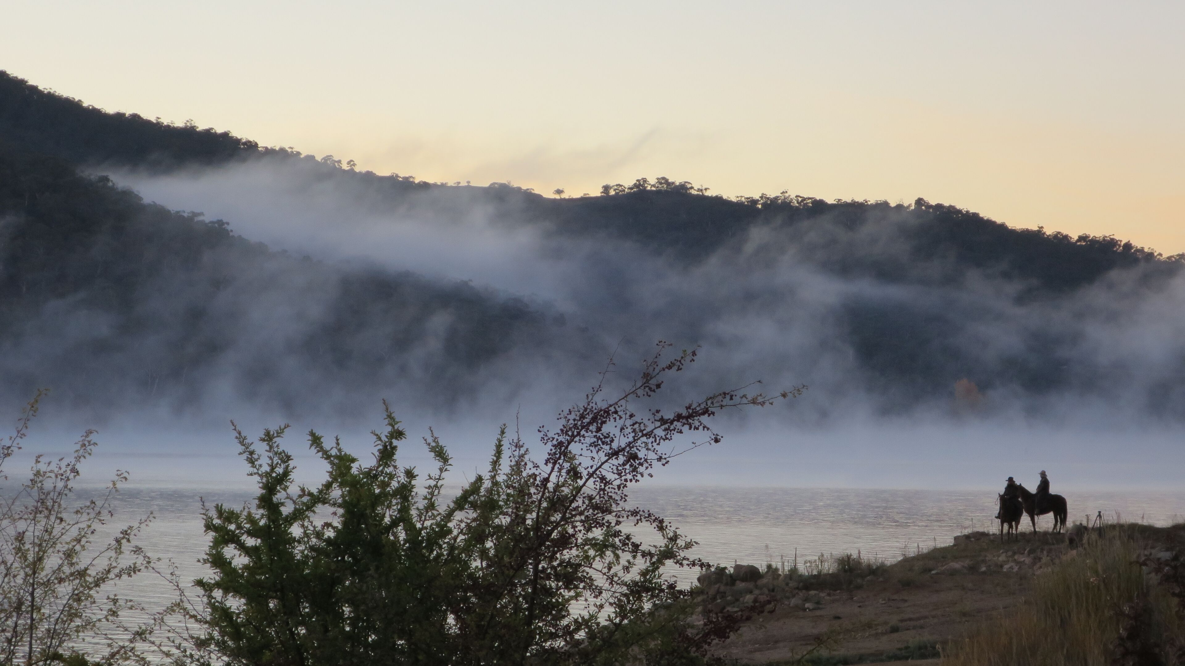 An early morning on ANZAC day, to riders pause before heading up to the community's dawn service, honouring the Australia and New Zealand Army Corps.
