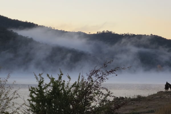 An early morning on ANZAC day, to riders pause before heading up to the community's dawn service, honouring the Australia and New Zealand Army Corps.