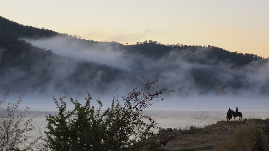 An early morning on ANZAC day, to riders pause before heading up to the community's dawn service, honouring the Australia and New Zealand Army Corps.