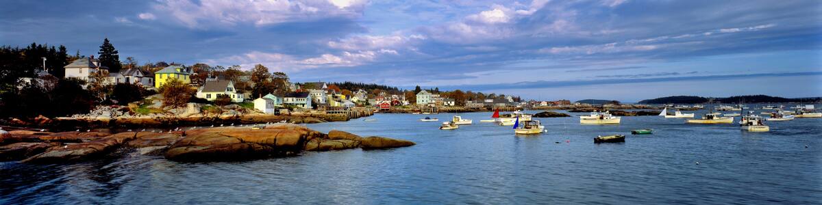 USA, Maine, Stonington. Blue-grey clouds sweep over the harbor of Stonington, Deer Island, Maine.