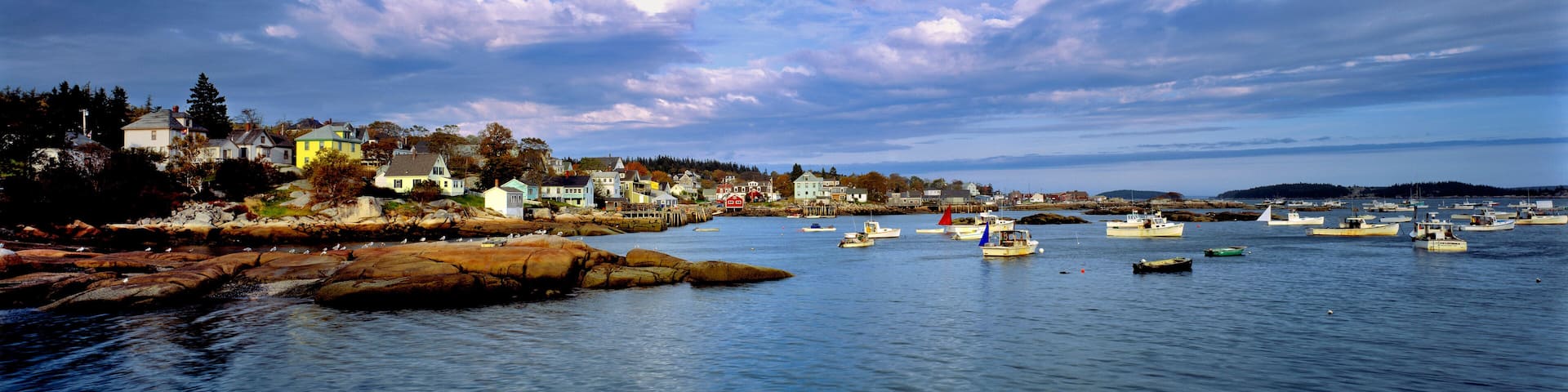 USA, Maine, Stonington. Blue-grey clouds sweep over the harbor of Stonington, Deer Island, Maine.