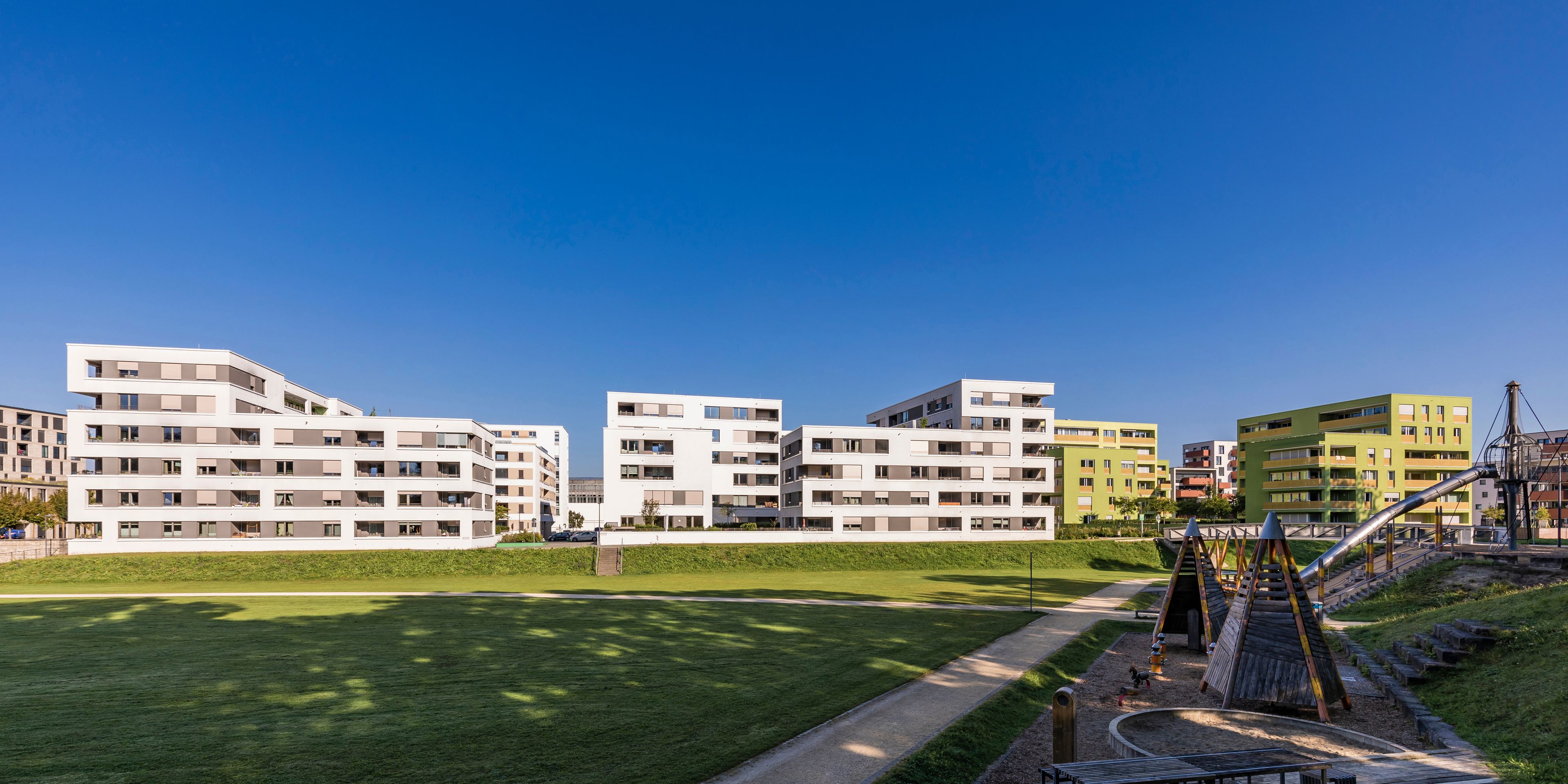 Germany, Baden-Wurttemberg, Ulm, Modern suburban apartments with public playground in foreground