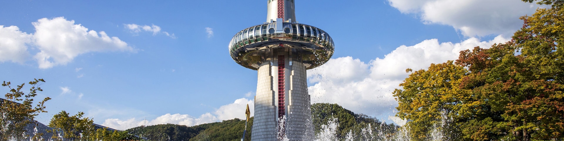 Yuseong-gu, Daejeon, South Korea - October 5, 2022: Summer view of square with fountain against Hanbit Tower at Expo Park