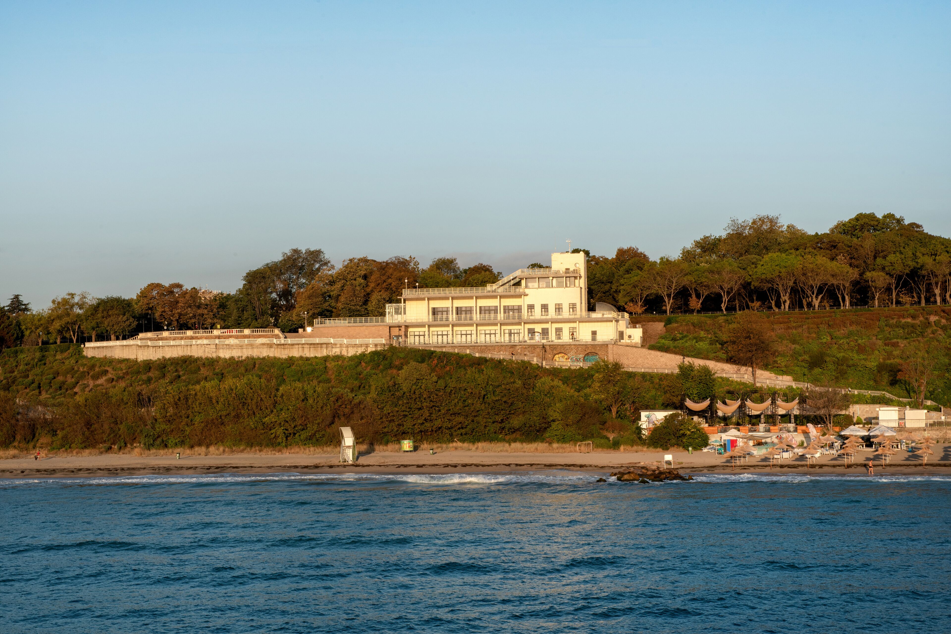 The iconic architecture of the Burgas Sea Casino building now a culture center overlooking the pier on the Black Sea coast of Burgas in Bulgaria .