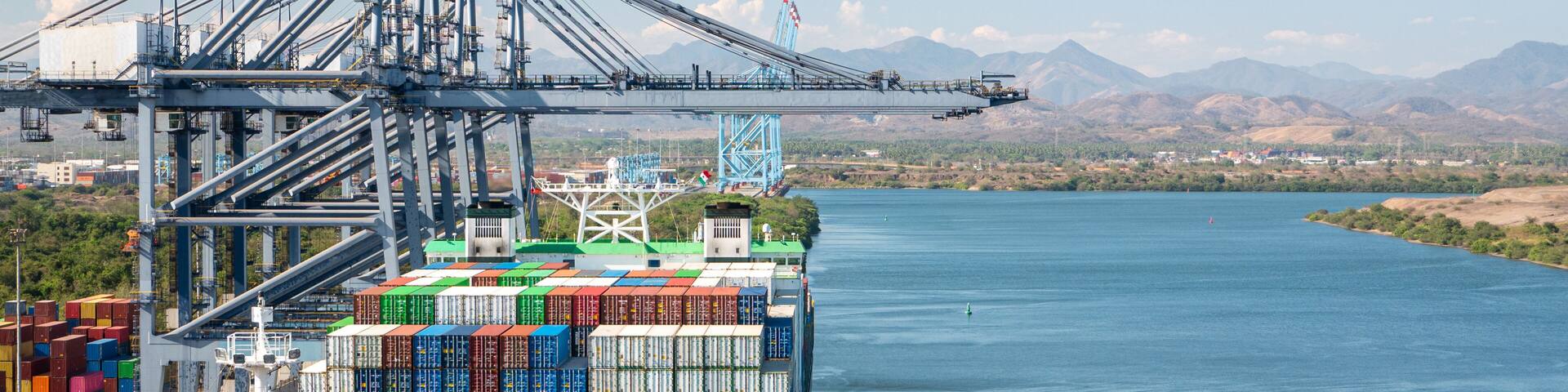 Two container ships has loading operations with few gantry cranes in Lazaro Cardenas Container Terminal during the the day time.