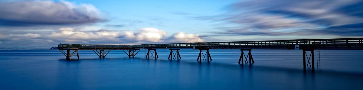 Wooden pier extending into the distance in Sidney Pier, Sidney, BC, Canada