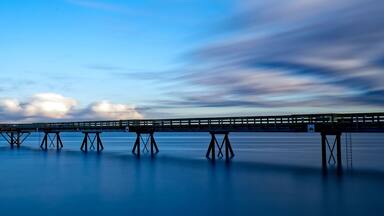 Wooden pier extending into the distance in Sidney Pier, Sidney, BC, Canada