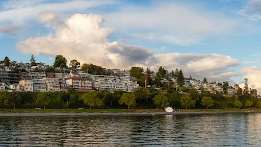 White Rock, British Columbia, Canada. Beautiful Panoramic View of Residential Homes on the Ocean Shore during a sunny and cloudy summer sunset.