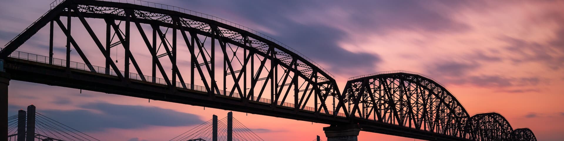 The Big Four Bridge that connected Kentucky and Indiana is an old railroad truss bridge, originally built in 1895, and was converted into a path for people to walk, run and bike across the Ohio River.