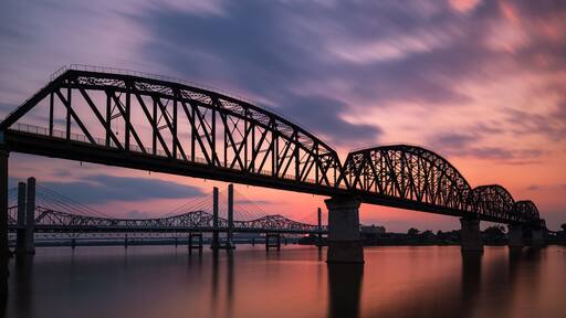 The Big Four Bridge that connected Kentucky and Indiana is an old railroad truss bridge, originally built in 1895, and was converted into a path for people to walk, run and bike across the Ohio River.