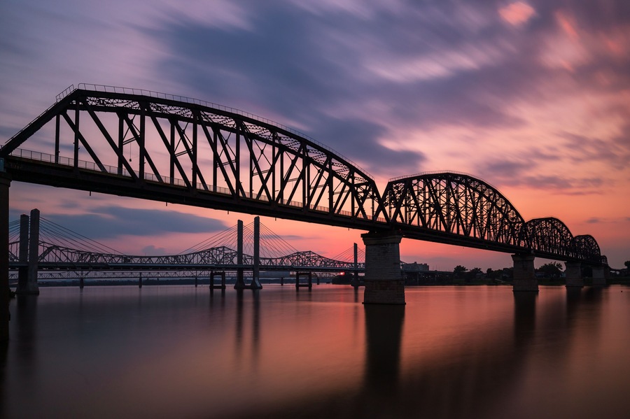 The Big Four Bridge that connected Kentucky and Indiana is an old railroad truss bridge, originally built in 1895, and was converted into a path for people to walk, run and bike across the Ohio River.