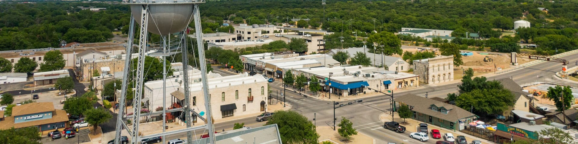 Round Rock featuring a small town or village, signage and landscape views