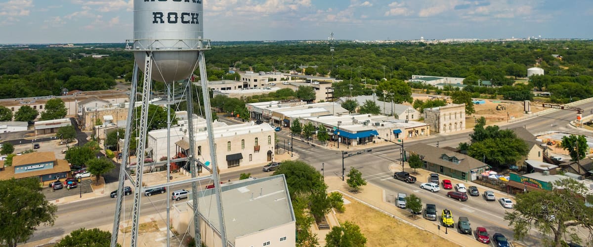 Round Rock featuring a small town or village, signage and landscape views