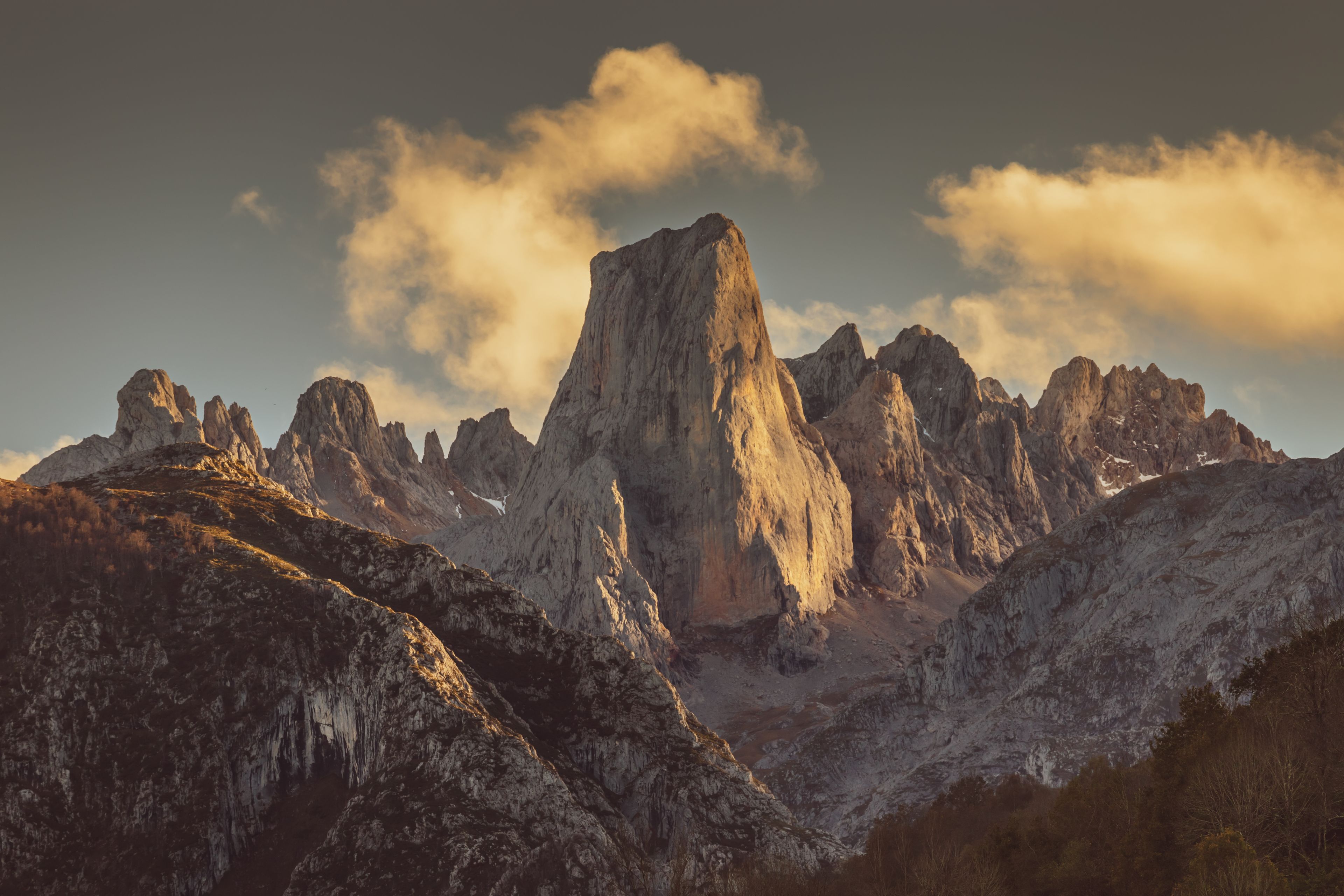 A mountain range with prominent peaks and a valley.