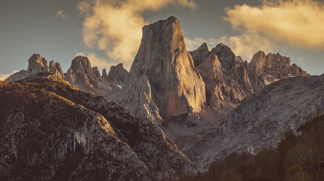 A mountain range with prominent peaks and a valley.