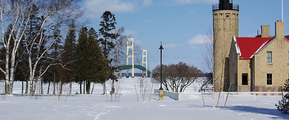 Mackinaw Point Lighthouse with the Mackinaw Bridge in the background. #OnTheRoad