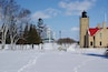 Mackinaw Point Lighthouse with the Mackinaw Bridge in the background. #OnTheRoad