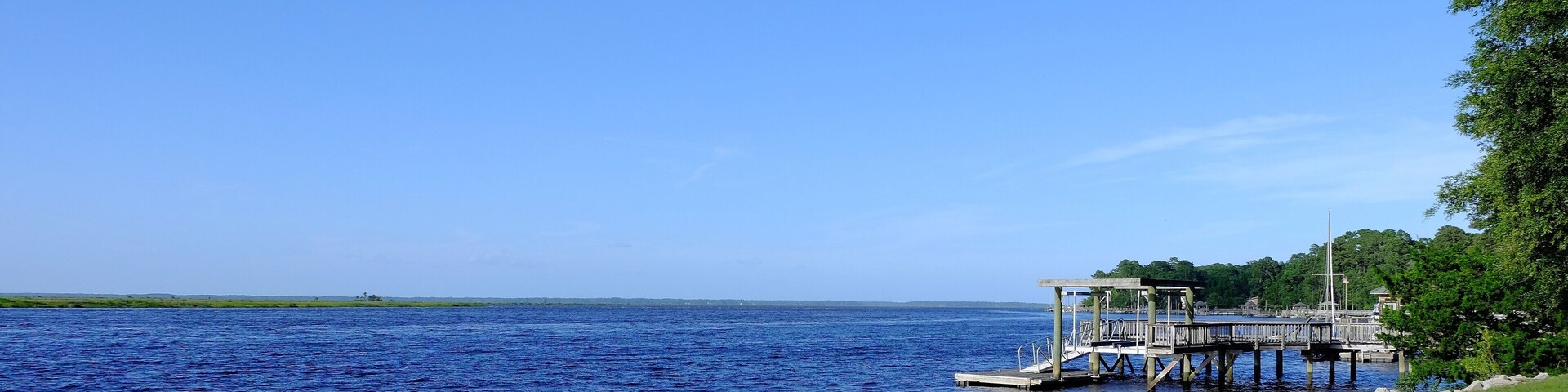 Boat dock with water view and blue sky; Shutterstock ID 469581212; Purchase Order: -
