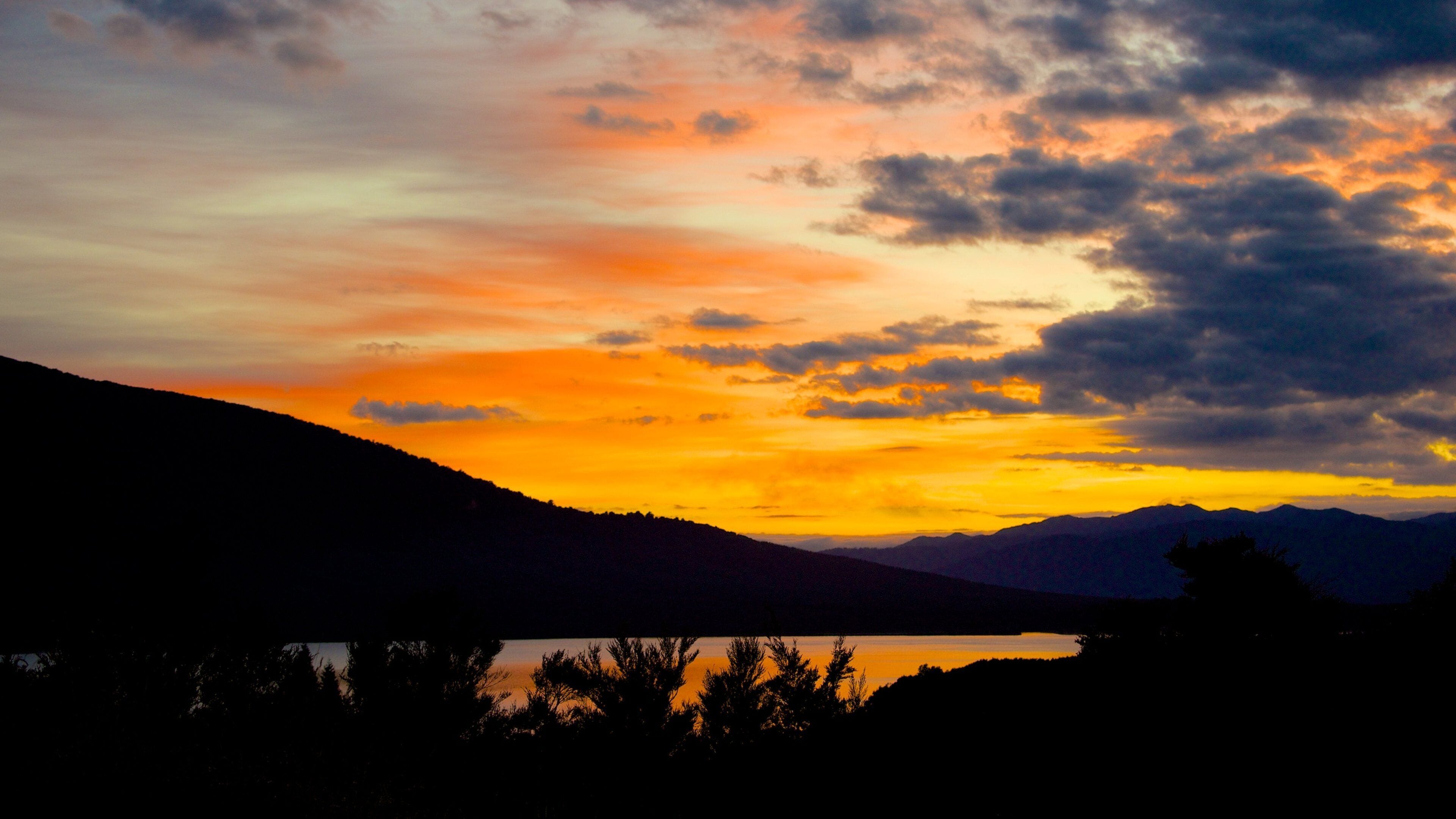 Turangi which includes landscape views and a sunset