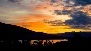 Turangi showing landscape views and a sunset