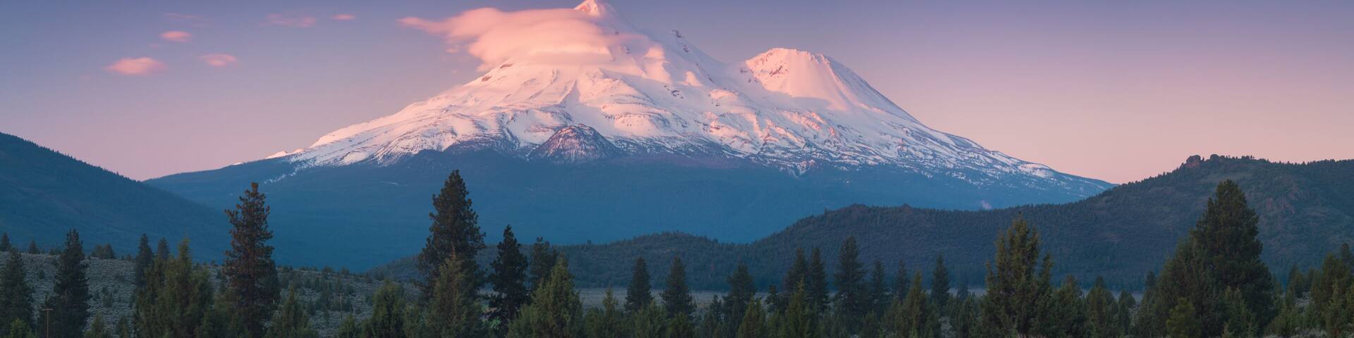 View of Mount Shasta Volcano with glaciers, in California, USA. Panorama from north. Mount Shasta is a potentially active volcano at the southern end of the Cascade Range in Siskiyou County