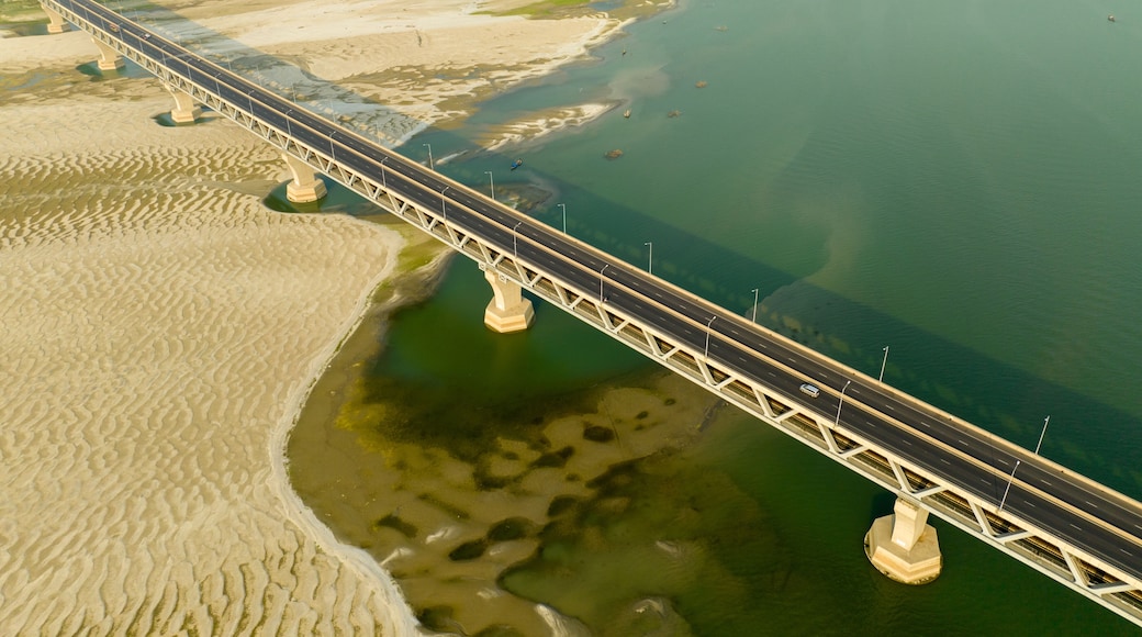 Aerial view of a bridge stretching across the river with sandbanks under a hazy sky, Mawa, Dhaka Division, Bangladesh.