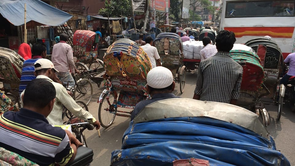 The daily craziness around old Dhaka with about 400,000 rickshaws competing for very little space.