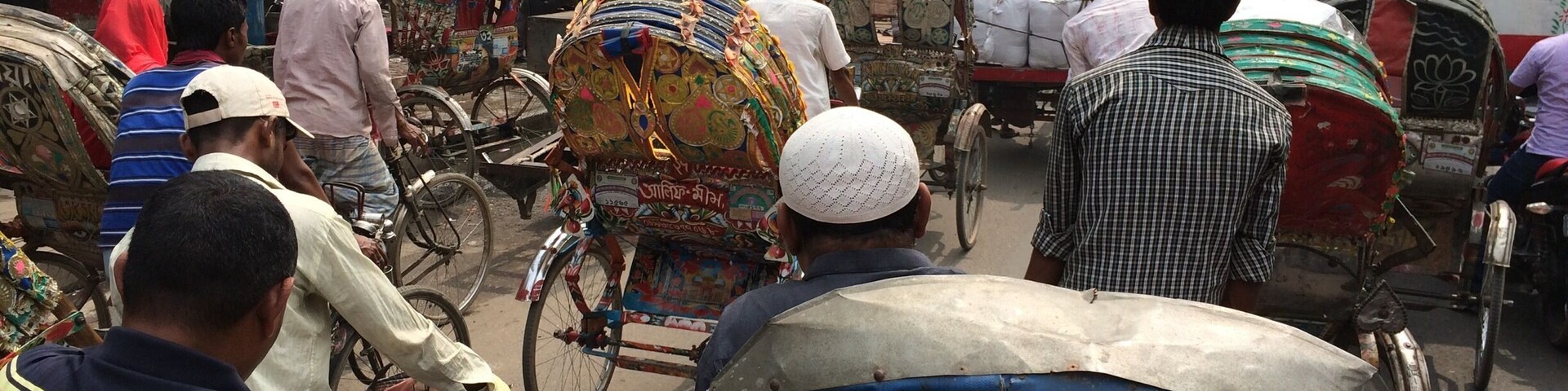 The daily craziness around old Dhaka with about 400,000 rickshaws competing for very little space.