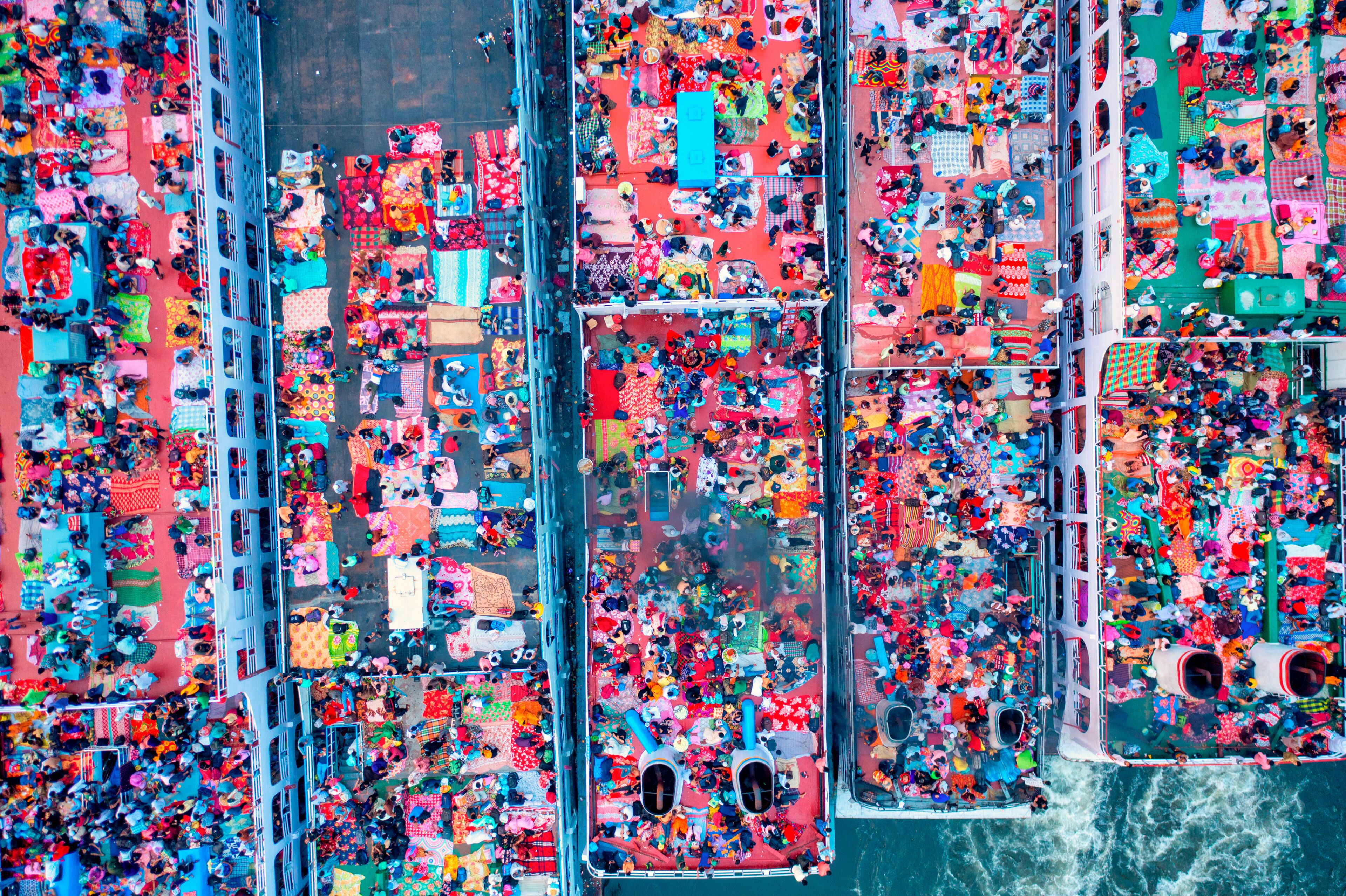 Aerial view of people onboard of a passenger ship along Buriganga river, Keraniganj, Dhaka, Bangladesh.
