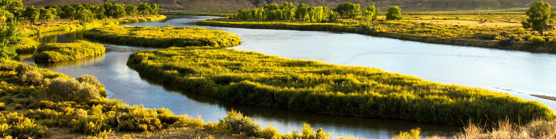 Panorama of the Green River as it flows through Browns Park National Wildlife Refuge, a wild, beautiful, remote area of mountains, prairies, and wetlands in the extreme northwest corner of Colorado