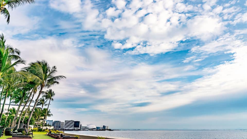 Blue skies along the coast of Pasay over the Manila Bay in the Philippines.