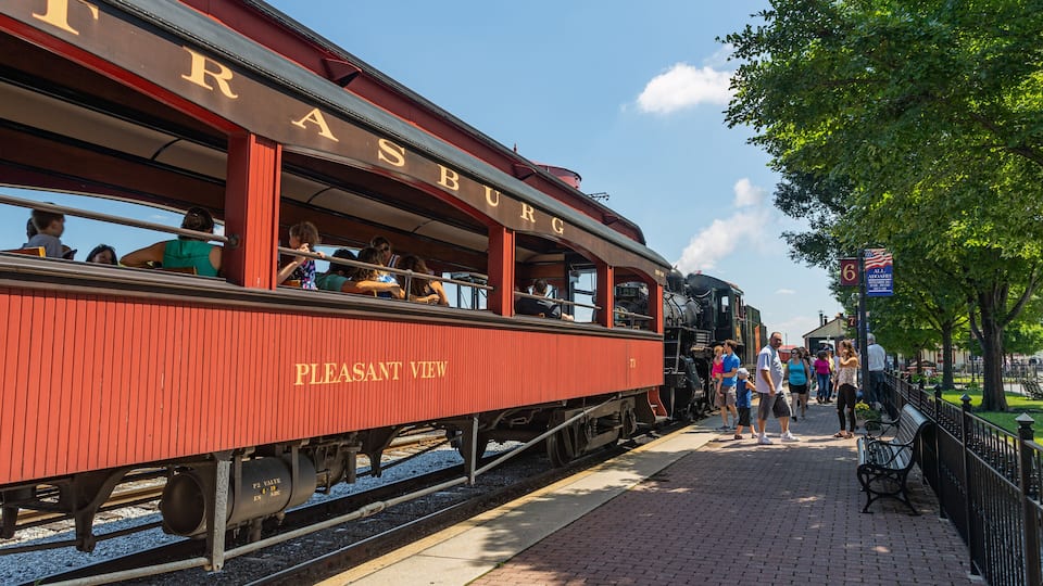 A red train with 'TRASBURN' and 'PLEASANT VIEW' written on it.