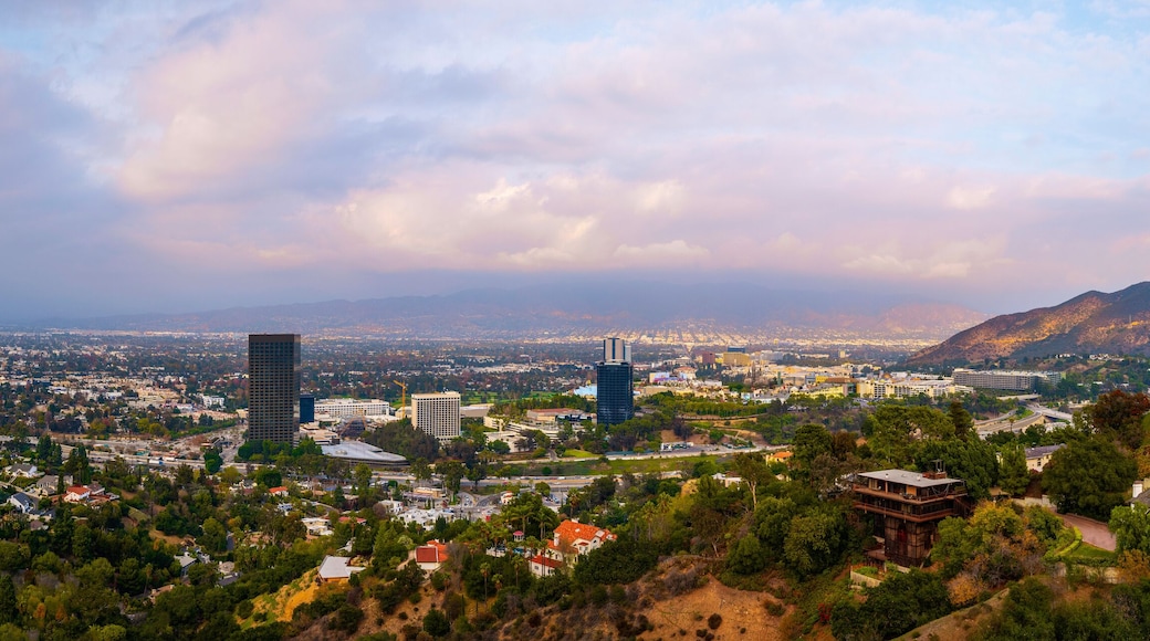 Universal City Skyline Sunset Cityscape over Mulholland Scenic Drive in Hollywood, Los Angeles, California, dramatic cloudscape, smog, and hills
