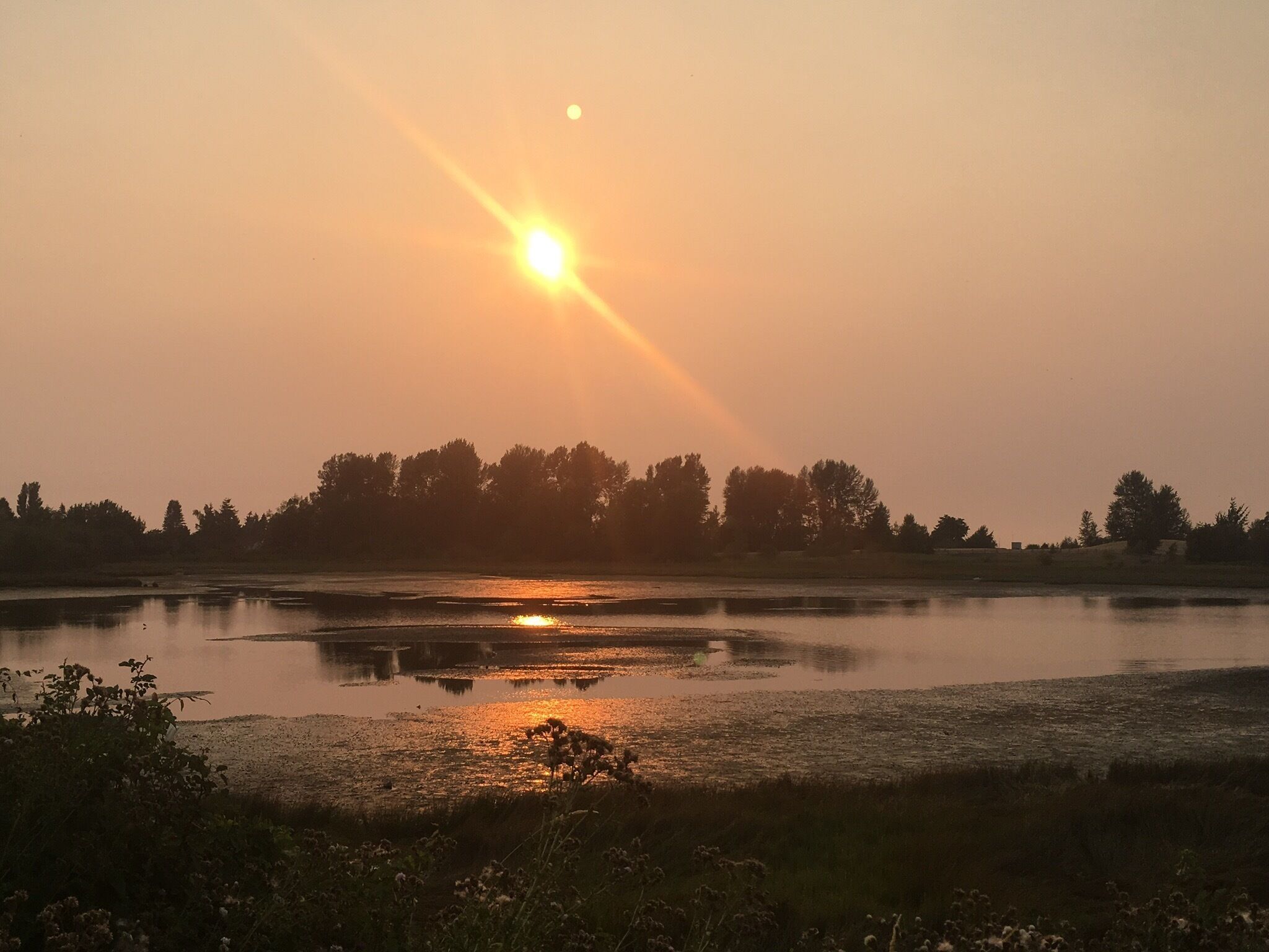 Sunset at crescent beach seen through the smoky haze that has settled in the lower mainland from the numerous fires burning in BC