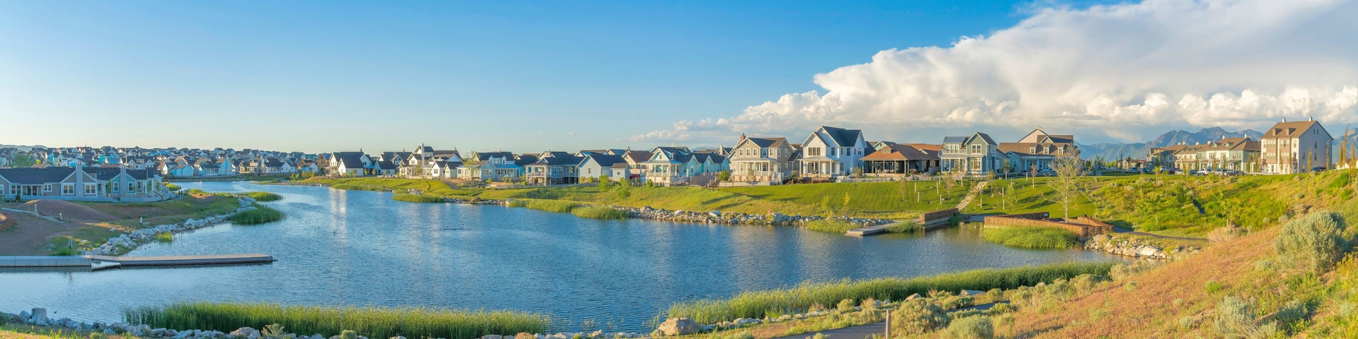 Residential houses surrounding the Oquirrh Lake at Daybreak, South Jordan, Utah
