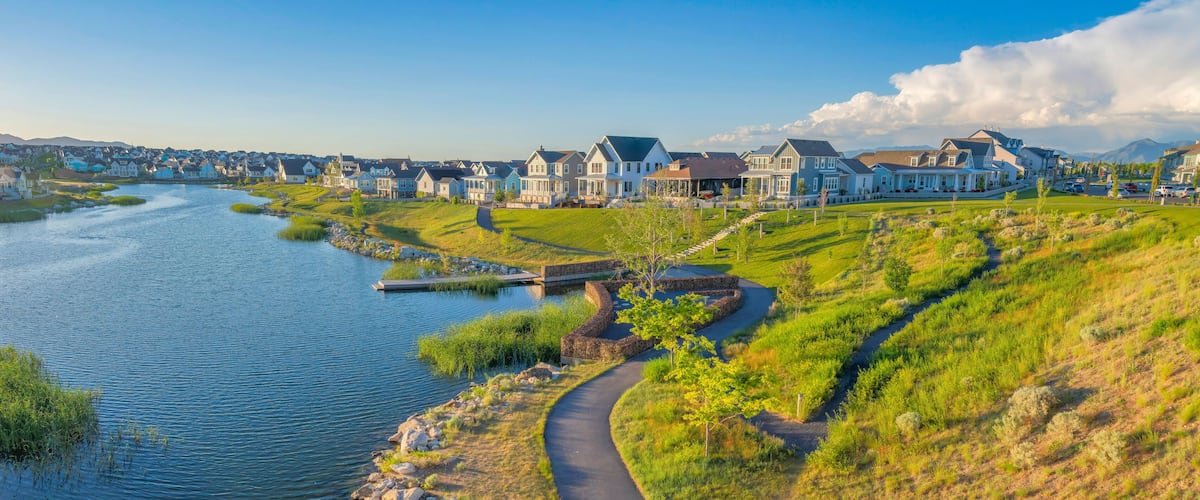 Oquirrh Lake at Daybreak residential community with concrete pavements on the side