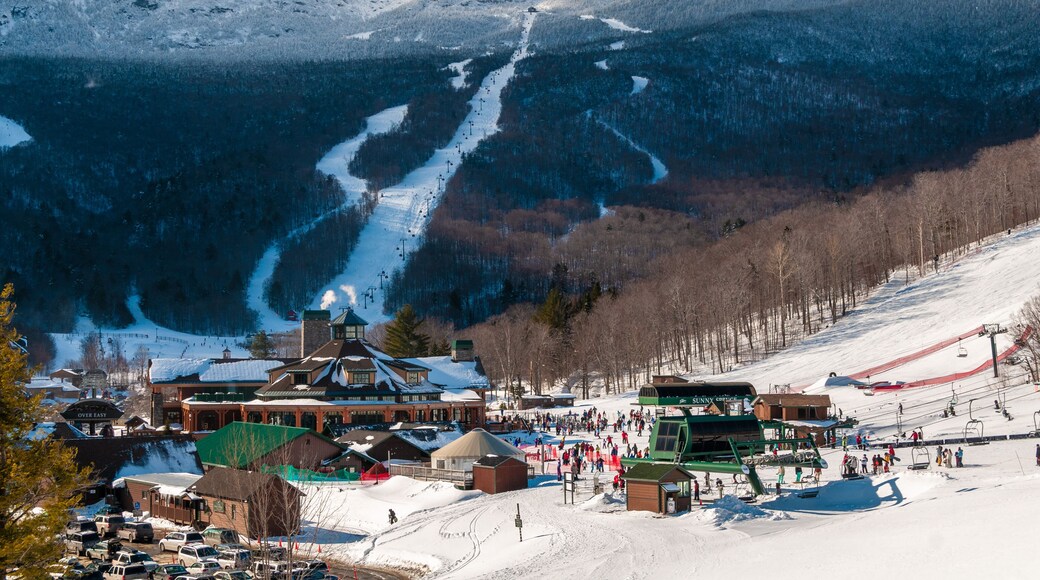 Spruce Peak Lodge in the winter with Mt. Mansfield in the background, Stowe, Vermont, USA